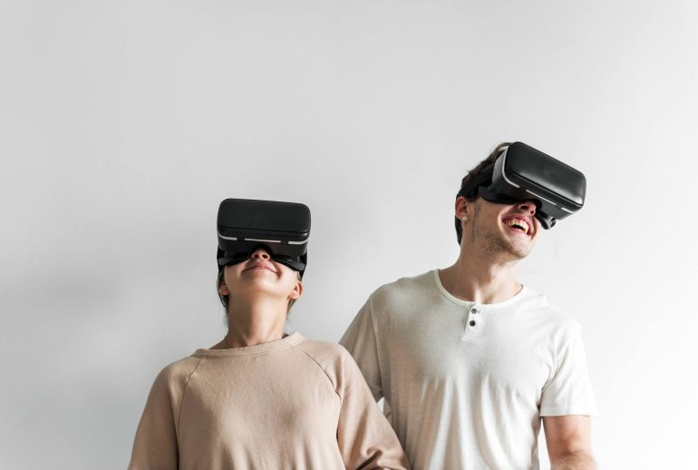 white couple experiencing virtual reality with vr AJZC7DN